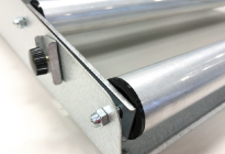To reduce static electricity generated by the rotation of the film roller, carbon-infused resin components are installed at both ends of the roller. This reduces discomfort during operation.